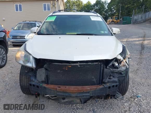 2012 Chevrolet Traverse 1LT z VIN 1GNKVGED6CJ166964, wystawiony jako IAAI lot #42913829 z przebiegiem 132 755 mil mil oraz . Historia ofert i sprzedaży dostępna na DreamBid. Obrazek 12.