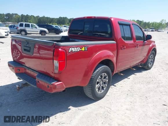 2014 Nissan Frontier S with VIN 1N6AD0EV3EN734085, listed as a IAAI auction lot 42007200 with Not provided miles and . Bid and sale history available at DreamBid. Image 4.
