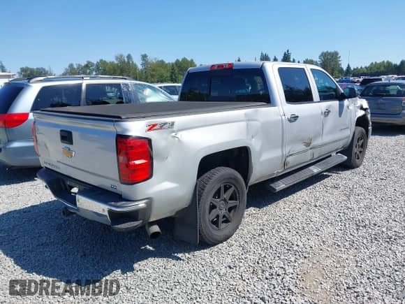 2014 Chevrolet Silverado 1500 LTZ with VIN 1GCUKSEC4EF197043, listed as a IAAI auction lot 42673341 with 131,445 mi miles and . Bid and sale history available at DreamBid. Image 4.