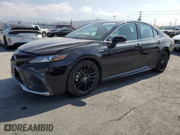 2021 Toyota Camry Hybrid XSE with VIN 4T1K31AK5MU549676, listed as a Copart auction lot 81924375 with 83,653 mi miles and Salvage title. Bid and sale history available at DreamBid. Image 1.