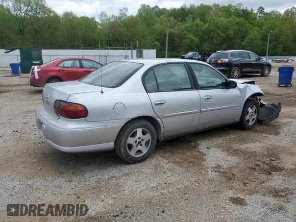 2004 Chevrolet Malibu Classic z VIN 1G1ND52F74M545029, wystawiony jako Copart lot #52122365 z przebiegiem 193 441 mil mil oraz Szkoda całkowita • Salvage title. Historia ofert i sprzedaży dostępna na DreamBid. Obrazek 3.