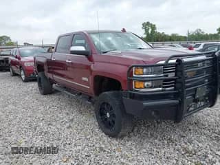2016 Chevrolet Silverado 2500HD High Country z VIN 1GC1KXE82GF210161, wystawiony jako IAAI lot #43229232 z przebiegiem 168 386 mil mil oraz . Historia ofert i sprzedaży dostępna na DreamBid. Obrazek 1.
