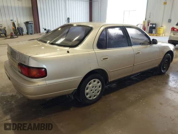 1996 Toyota Camry DX with VIN JT2BG12K4T0389473, listed as a IAAI auction lot 42764511 with 258,187 mi miles and . Bid and sale history available at DreamBid. Image 4.
