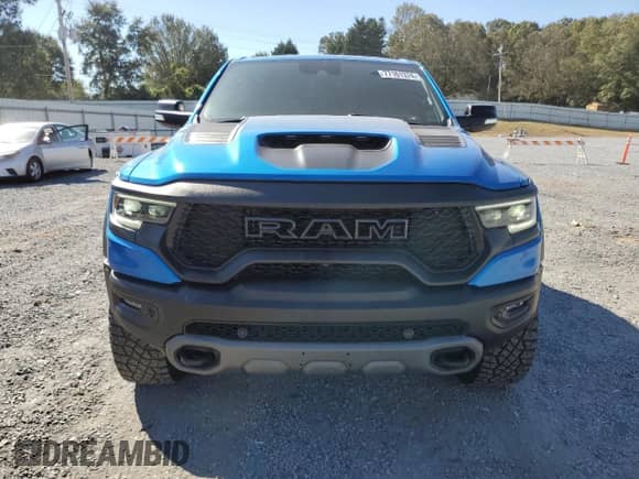 2022 Ram 1500 TRX with VIN 1C6SRFU93NN229879, listed as a Copart auction lot 77161374 with 7,836 mi miles and Salvage title. Bid and sale history available at DreamBid. Image 5.