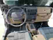 1999 Jeep Wrangler Sahara с VIN 1J4FY49S9XP425310, выставлен на аукционе Copart как лот 64079085 с пробегом 179 730 миль миль и На запчасти • Non repairable. История ставок и продаж доступна на DreamBid. Изображение 8.