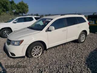 2014 Dodge Journey SXT with VIN 3C4PDCBG3ET118732, listed as a Copart auction lot 68508215 with 118,897 mi miles and Salvage title. Bid and sale history available at DreamBid. Image 1.