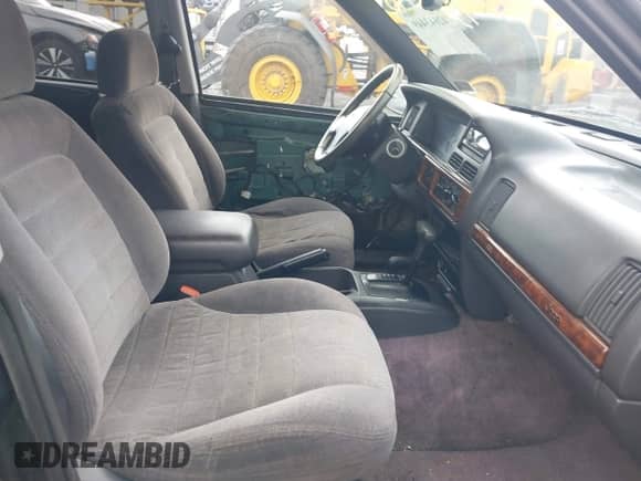 1996 Jeep Grand Cherokee with VIN 1J4EZ58Y7TC128302, listed as a IAAI auction lot 42643449 with 282,036 mi miles and . Bid and sale history available at DreamBid. Image 5.