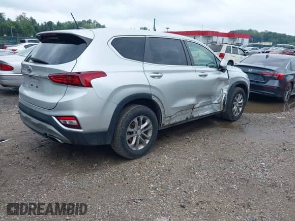 2019 Hyundai Santa Fe SE z VIN 5NMS23AD0KH011086, wystawiony jako IAAI lot #43300514 z przebiegiem 109 476 mil mil oraz . Historia ofert i sprzedaży dostępna na DreamBid. Obrazek 4.