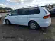 2002 Honda Odyssey EX z VIN 2HKRL18682H551537, wystawiony jako Copart lot #84208275 z przebiegiem 128 632 mil mil oraz Szkoda całkowita • Salvage title. Historia ofert i sprzedaży dostępna na DreamBid. Obrazek 2.