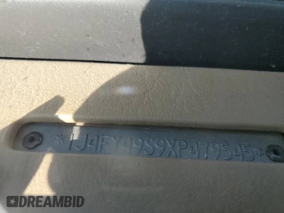 1999 Jeep Wrangler Sahara with VIN 1J4FY49S9XP479545, listed as a Copart auction lot 54753745 with 34,642 mi miles and Salvage title. Bid and sale history available at DreamBid. Image 12.