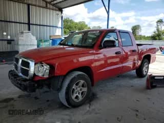 2006 Dodge Dakota SLT with VIN 1D7HE48N56S588301, listed as a Copart auction lot 68264765 with 117,250 mi miles and Salvage title. Bid and sale history available at DreamBid. Image 1.