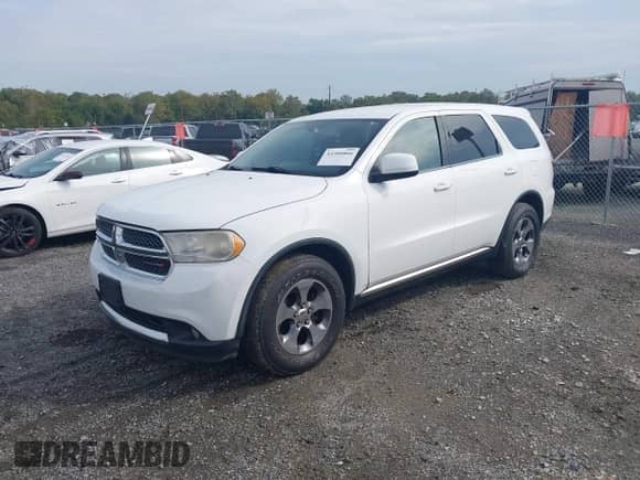 2013 Dodge Durango SXT with VIN 1C4RDHAG0DC693064, listed as a IAAI auction lot 43300866 with 244,392 mi miles and . Bid and sale history available at DreamBid. Image 2.