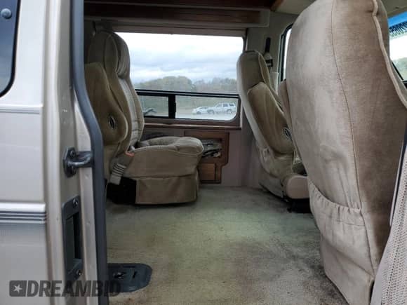 2001 Ford Econoline Cargo Recreational z VIN 1FDRE14L11HB20956, wystawiony jako Copart lot #87220655 z przebiegiem 147 875 mil mil oraz Szkoda całkowita • Salvage title. Historia ofert i sprzedaży dostępna na DreamBid. Obrazek 11.