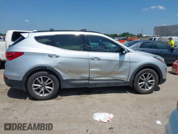 2016 Hyundai Santa Fe with VIN 5XYZU3LA2GG325786, listed as a IAAI auction lot 42515766 with 214,896 mi miles and . Bid and sale history available at DreamBid. Image 13.