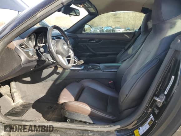 2013 BMW Z4 sDrive28i with VIN WBALL5C50DJ103778, listed as a Copart auction lot 49452215 with 104,203 mi miles and Salvage title. Bid and sale history available at DreamBid. Image 7.