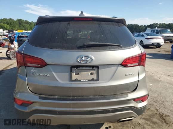 2017 Hyundai Santa Fe 2.4L z VIN 5NMZU3LB6HH038970, wystawiony jako Copart lot #69933835 z przebiegiem 174 618 mil mil oraz Szkoda całkowita • Salvage title. Historia ofert i sprzedaży dostępna na DreamBid. Obrazek 6.