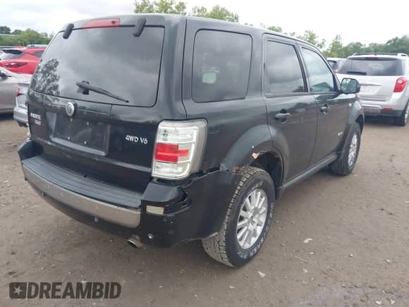 2008 Mercury Mariner Premier with VIN 4M2CU97178KJ44773, listed as a IAAI auction lot 43028644 with 186,934 mi miles and . Bid and sale history available at DreamBid. Image 4.