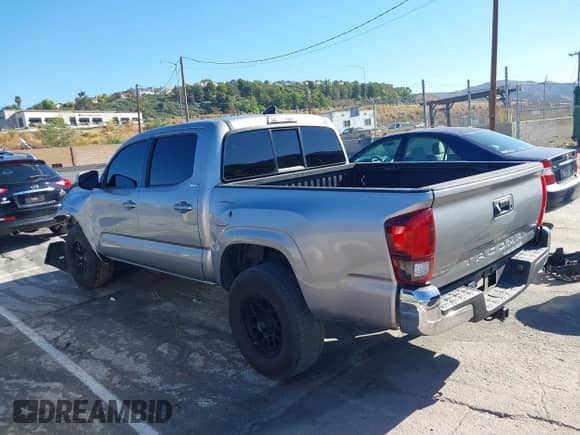 2019 Toyota Tacoma SR with VIN 5TFAX5GNXKX159942, listed as a IAAI auction lot 43359385 with 56,362 mi miles and . Bid and sale history available at DreamBid. Image 3.