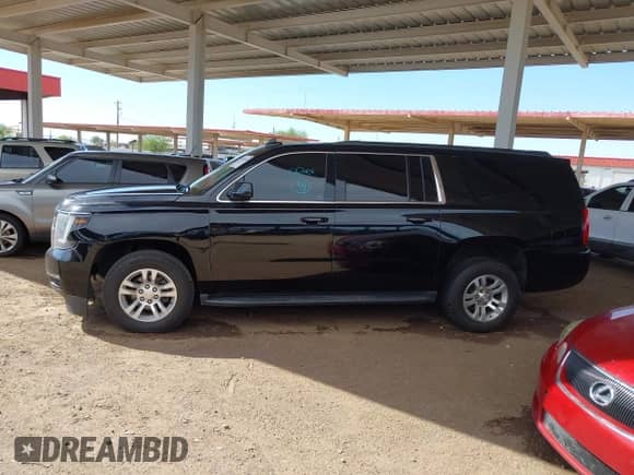 2019 Chevrolet Suburban LT z VIN 1GNSCHKCXKR127429, wystawiony jako IAAI lot #43013423 z przebiegiem 112 893 mil mil oraz . Historia ofert i sprzedaży dostępna na DreamBid. Obrazek 13.