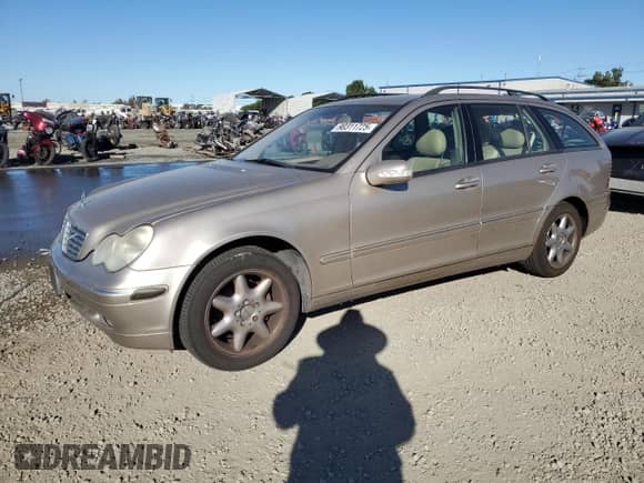 2003 Mercedes-Benz C 240 with VIN WDBRH61J73F315954, listed as a Copart auction lot 90311725 with 74,343 mi miles and Salvage title. Bid and sale history available at DreamBid. Image 1.