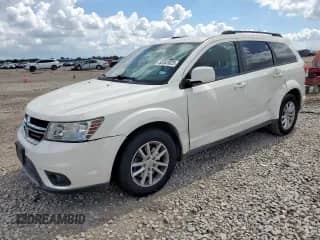2013 Dodge Journey SXT with VIN 3C4PDCBG7DT637071, listed as a Copart auction lot 82041625 with 123,514 mi miles and Salvage title. Bid and sale history available at DreamBid. Image 1.