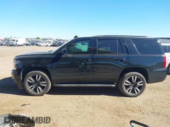 2018 Chevrolet Tahoe Premier with VIN 1GNSCCKJ5JR296869, listed as a IAAI auction lot 43495546 with 77,198 mi miles and . Bid and sale history available at DreamBid. Image 14.