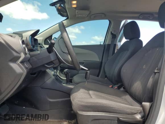 2014 Chevrolet Sonic LT with VIN 1G1JC6SB6E4239719, listed as a Copart auction lot 67077005 with 90,958 mi miles and Salvage title. Bid and sale history available at DreamBid. Image 7.
