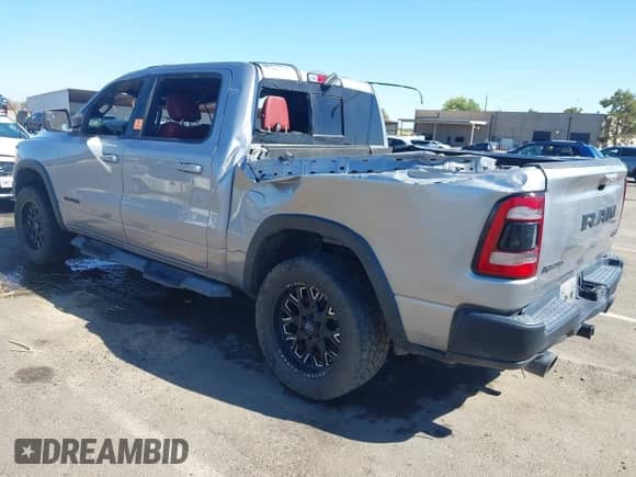 2019 Ram 1500 Rebel z VIN 1C6SRFLTXKN692868, wystawiony jako IAAI lot #43031939 z przebiegiem Nie podano mil oraz . Historia ofert i sprzedaży dostępna na DreamBid. Obrazek 3.