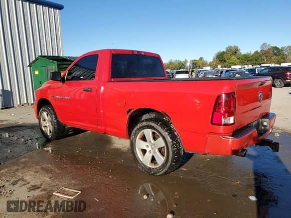 2012 Ram 1500 Express with VIN 3C6JD7AT0CG263039, listed as a Copart auction lot 84575185 with 202,886 mi miles and Salvage title. Bid and sale history available at DreamBid. Image 2.