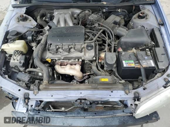 1997 Toyota Camry LE z VIN JT2BF22K7V0028444, wystawiony jako Copart lot #57609885 z przebiegiem 296 229 mil mil oraz Szkoda całkowita • Salvage title. Historia ofert i sprzedaży dostępna na DreamBid. Obrazek 11.