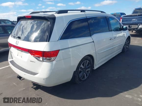 2016 Honda Odyssey Touring Elite z VIN 5FNRL5H9XGB047482, wystawiony jako IAAI lot #43439998 z przebiegiem 184 606 mil mil oraz . Historia ofert i sprzedaży dostępna na DreamBid. Obrazek 4.