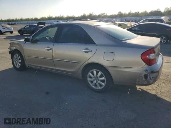 2004 Toyota Camry LE z VIN JTDBE32K140255496, wystawiony jako Copart lot #83874805 z przebiegiem 287 349 mil mil oraz Szkoda całkowita • Salvage title. Historia ofert i sprzedaży dostępna na DreamBid. Obrazek 2.