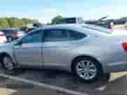 2017 Chevrolet Impala LT z VIN 1G1105S37HU210536, wystawiony jako IAAI lot #43265606 z przebiegiem 147 505 mil mil oraz . Historia ofert i sprzedaży dostępna na DreamBid. Obrazek 14.