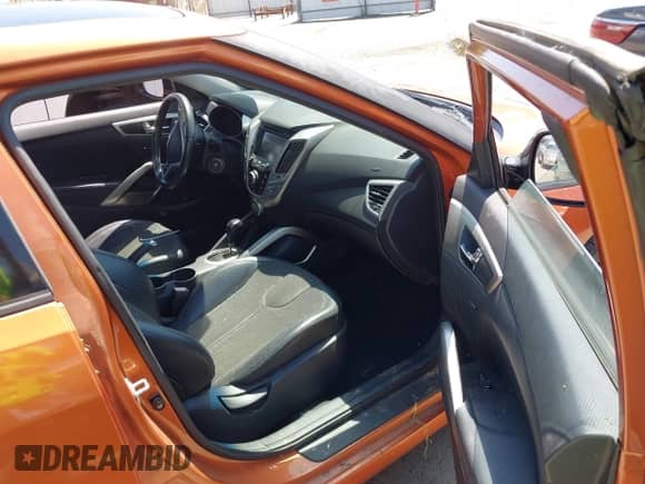 2012 Hyundai Veloster w/Black Int z VIN KMHTC6AD4CU049722, wystawiony jako IAAI lot #42594609 z przebiegiem 72 324 mil mil oraz . Historia ofert i sprzedaży dostępna na DreamBid. Obrazek 5.