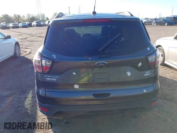 2018 Ford Escape SE z VIN 1FMCU9GD5JUB12944, wystawiony jako IAAI lot #43497420 z przebiegiem 172 518 mil mil oraz . Historia ofert i sprzedaży dostępna na DreamBid. Obrazek 16.
