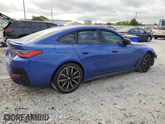 2024 BMW 4 Series M440i with VIN WBA63AW01RFP69080, listed as a Copart auction lot 58102504 with Not provided miles and Salvage title. Bid and sale history available at DreamBid. Image 3.