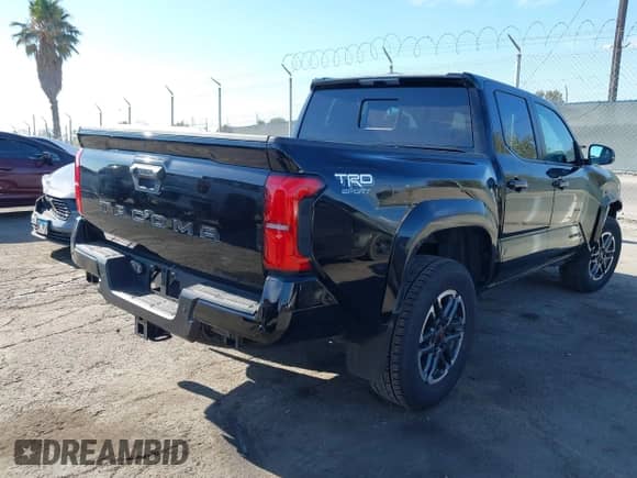 2024 Toyota Tacoma SR5 with VIN 3TMKB5FN3RM000779, listed as a IAAI auction lot 43081279 with 24,906 mi miles and . Bid and sale history available at DreamBid. Image 4.