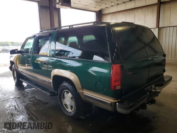 1999 Chevrolet Suburban with VIN 1GNFK16R1XJ386729, listed as a Copart auction lot 80654155 with 180,019 mi miles and Salvage title. Bid and sale history available at DreamBid. Image 2.