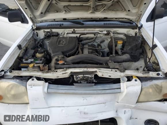 2001 Nissan Frontier XE with VIN 1N6DD21S41C353033, listed as a Copart auction lot 81809955 with 100,722 mi miles and Salvage title. Bid and sale history available at DreamBid. Image 11.