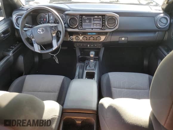 2023 Toyota Tacoma SR with VIN 3TMCZ5ANXPM559511, listed as a Copart auction lot 80508385 with 33,176 mi miles and Salvage title. Bid and sale history available at DreamBid. Image 8.