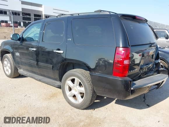 2014 Chevrolet Tahoe LS with VIN 1GNSCAE05ER129327, listed as a IAAI auction lot 42927037 with 149,789 mi miles and . Bid and sale history available at DreamBid. Image 3.