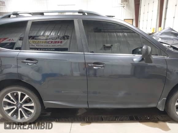 2018 Subaru Forester Premium with VIN JF2SJGEC2JH604459, listed as a IAAI auction lot 42514080 with 127,218 mi miles and . Bid and sale history available at DreamBid. Image 13.