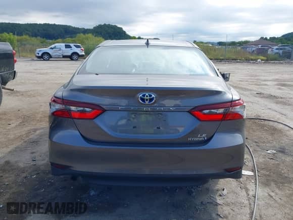 2021 Toyota Camry Hybrid LE with VIN 4T1H31AK0MU553127, listed as a IAAI auction lot 43099811 with 27,442 mi miles and . Bid and sale history available at DreamBid. Image 16.