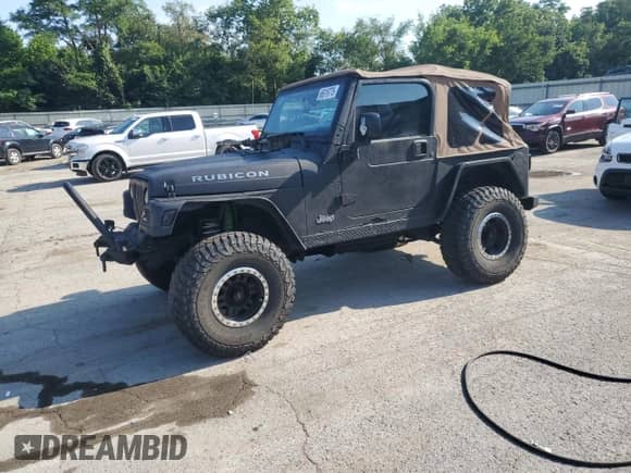 2003 Jeep Wrangler Rubicon с VIN 1J4FA69S23P310588, выставлен на аукционе Copart как лот 66919775 с пробегом 106 685 миль миль и Списание • Salvage title. История ставок и продаж доступна на DreamBid. Изображение 1.