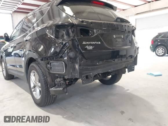 2018 Hyundai Santa Fe 2.4L with VIN 5NMZU3LB1JH054077, listed as a IAAI auction lot 43286208 with 81,100 mi miles and . Bid and sale history available at DreamBid. Image 6.