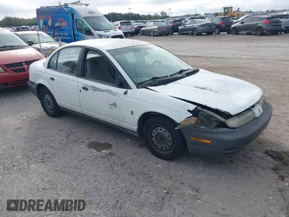 1999 Saturn SL с VIN 1G8ZH5284XZ318834, выставлен на аукционе IAAI как лот 41486518 с пробегом 178 227 миль миль и . История ставок и продаж доступна на DreamBid. Изображение 1.