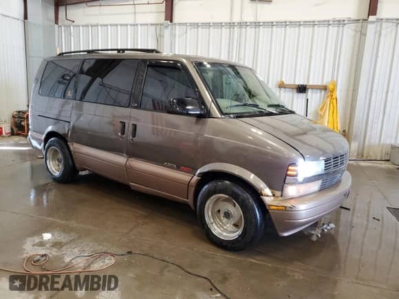 2000 Chevrolet Astro z VIN 1GNEL19W1YB207689, wystawiony jako Copart lot #54711595 z przebiegiem 253 766 mil mil oraz Nie do naprawy • Non repairable. Historia ofert i sprzedaży dostępna na DreamBid. Obrazek 4.