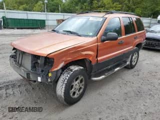 1999 Jeep Grand Cherokee Laredo с VIN 1J4GW58S7XC518416, выставлен на аукционе Copart как лот 71608535 с пробегом 222 071 миль миль и Списание • Salvage title. История ставок и продаж доступна на DreamBid. Изображение 1.
