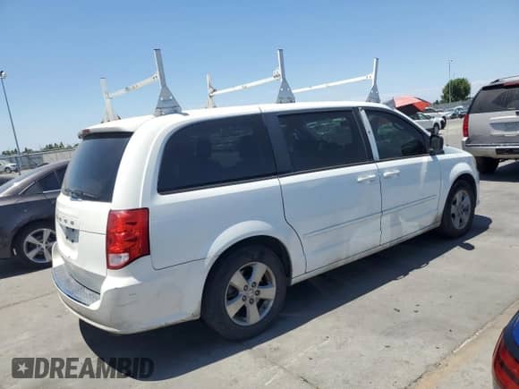 2013 Dodge Grand Caravan American Value with VIN 2C4RDGBG5DR516901, listed as a Copart auction lot 63338975 with 230,644 mi miles and Clean title. Bid and sale history available at DreamBid. Image 3.