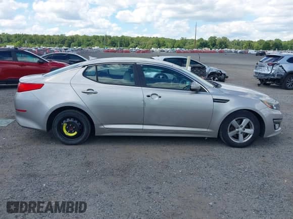2015 Kia Optima LX with VIN 5XXGM4A75FG379610, listed as a IAAI auction lot 43074307 with 121,698 mi miles and . Bid and sale history available at DreamBid. Image 13.